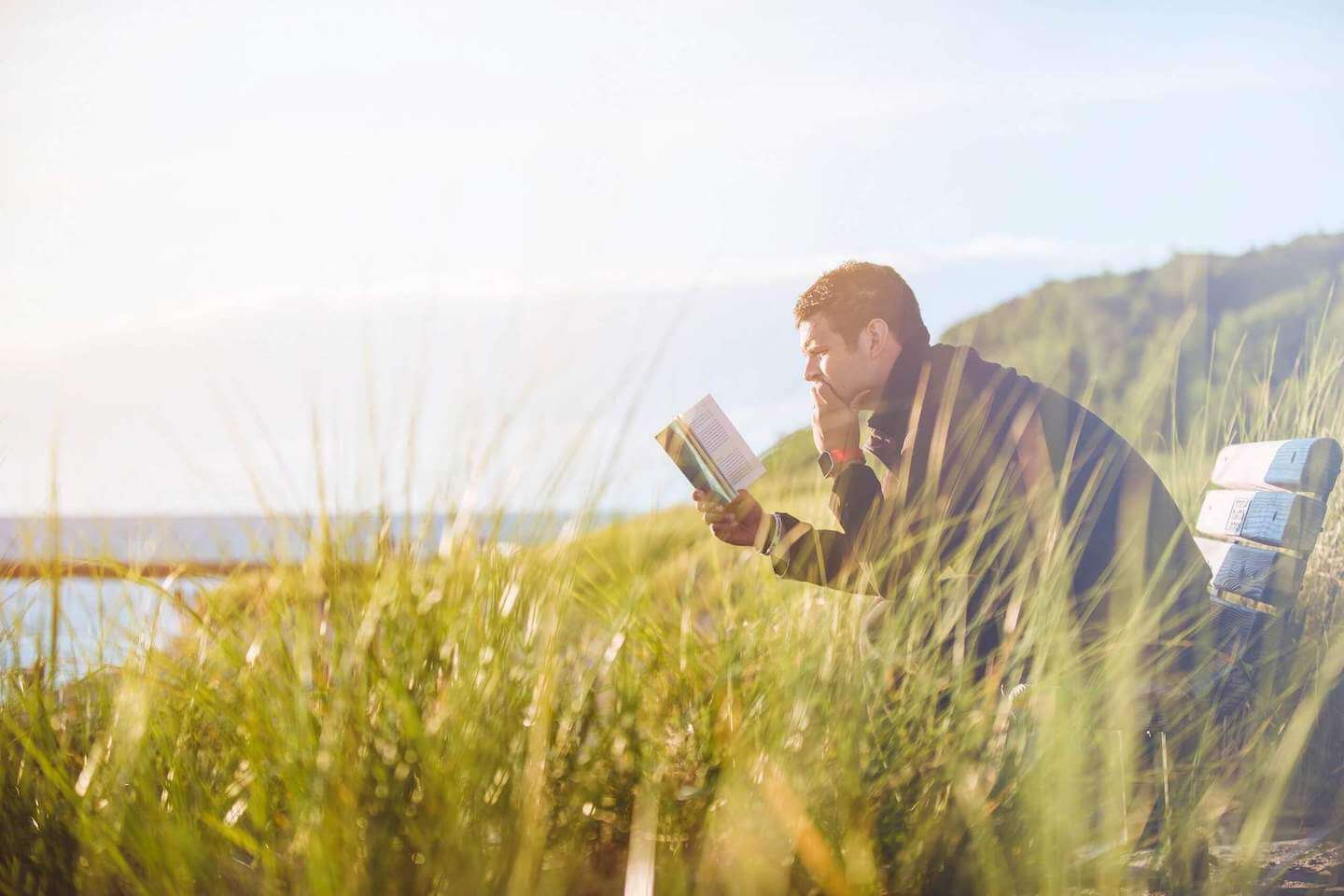 Man reading in a field