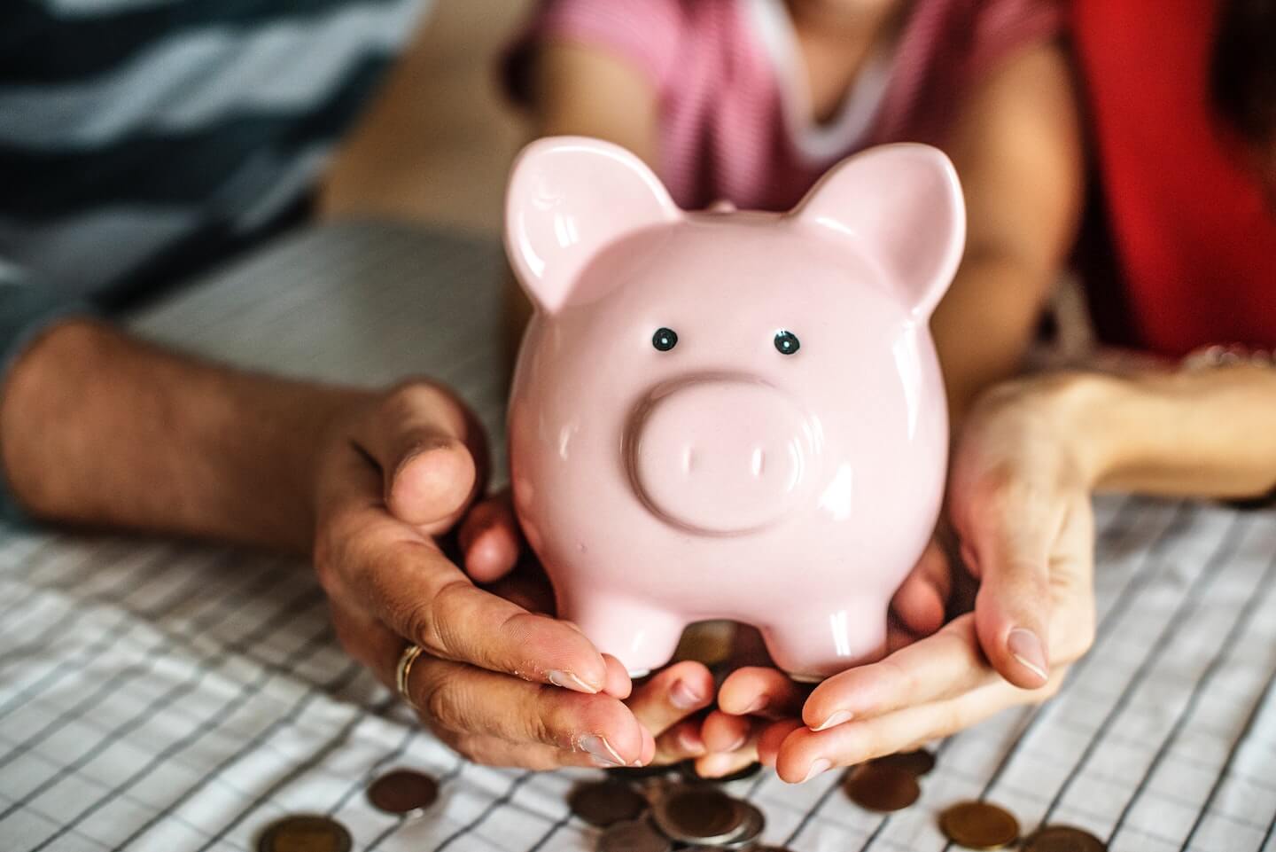 Piggy bank resting in hands